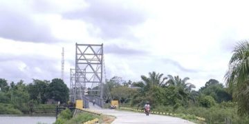 Pj Gubri Tinjau Pembangunan Jalan Akses Jembatan Gantung Sipungguk Kampar